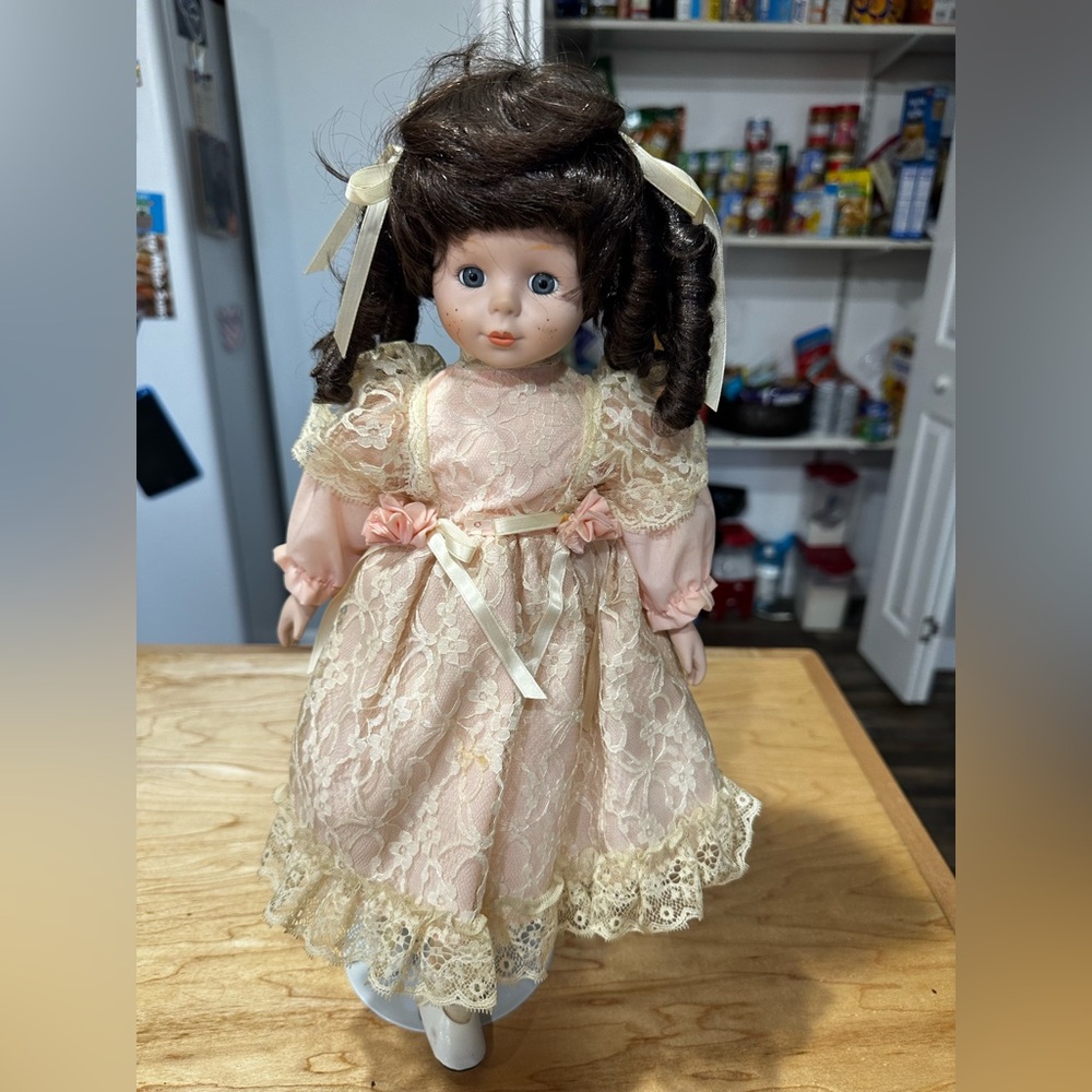 Brown Haired Porcelain Doll